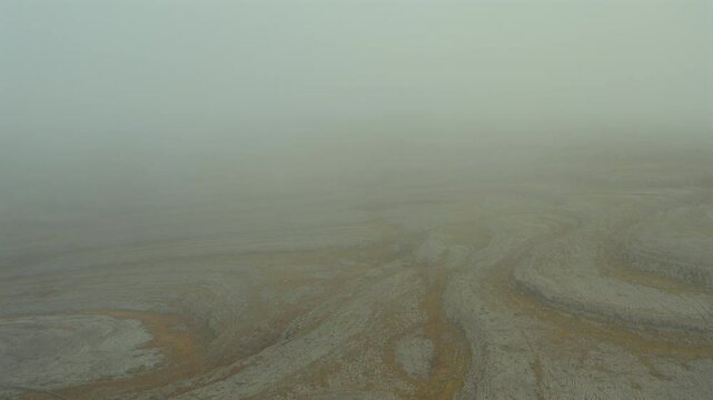Fade from mist to the slopes of the Burren's most beautiful mountains as drone descends