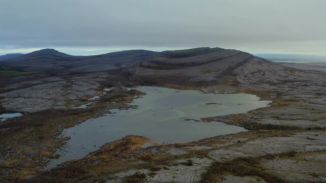 Aerial push-in capturing Mullaghmore's vast panoramic vista in the Burren, Ireland.