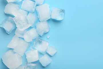 Many frozen ice cubes on blue background