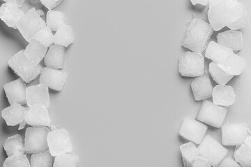 Many frozen ice cubes on grey background