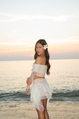 Beautiful Young Thai Woman at Tropical Beach During Sunset