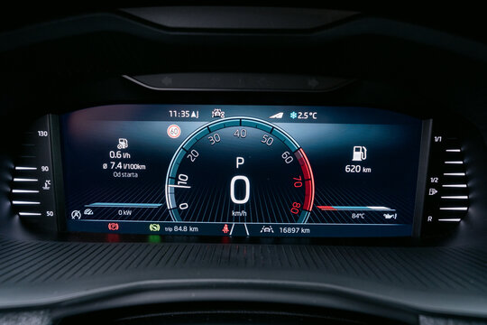 Modern car dashboard displaying speed fuel level and other vital information