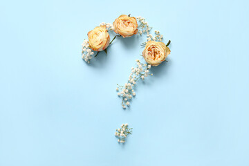 Question mark made of beautiful flowers on color background