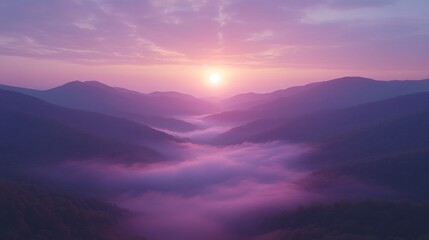 Fototapeta premium Sunrise over misty mountain valley