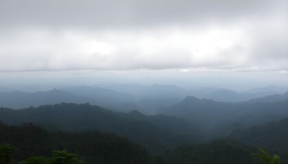 Fototapeta premium Breathtaking panoramic view of layered mountain forests under a cloudy sky in Mae Hong Son, Thailand, showcasing lush greenery and natural beauty