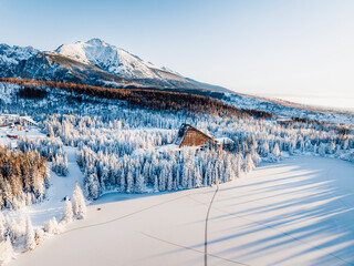 Frozen winter mountain lake Strbske pleso. Strbske lake with view of the High Tatras National Park, Slovakia