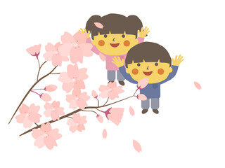 満開の桜の木を見上げる子供たち