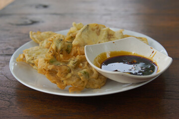 Mendoan Tempe with spicy sauce, Mendoan Tempe is a food made from Tempe fried with wheat flour