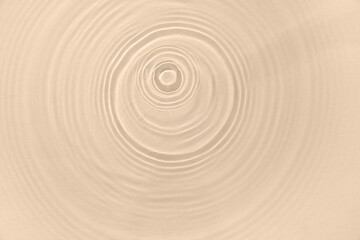 Texture of clean water with splashes on beige background