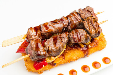 beef skewer on the white