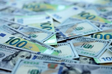 Big pile of Euro and USD banknotes. Many european and united states dollars