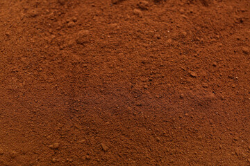 Heap of coffee powder as background, closeup