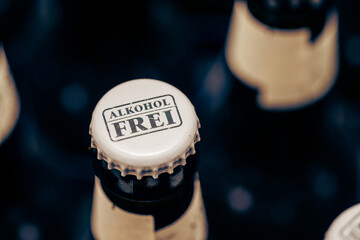 Bottlecap of beer bottle with label that spells 