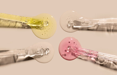 samples serum tests glass pipettes with drops of serum on a light beige background