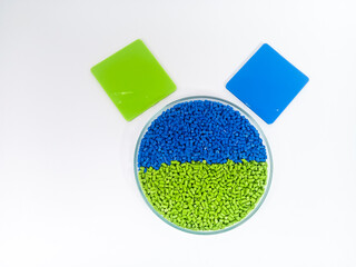 plastic masterbatch, masterbatch granules, polymer carrying pigment poured into a glass cup forming...