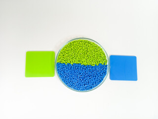 plastic masterbatch, masterbatch granules, polymer carrying pigment poured into a glass cup forming...