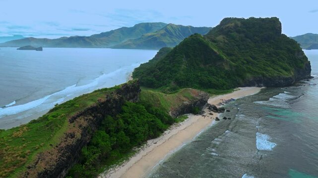 Aerial shot very high above mountain range at Capones Island, Pundaquit beach. Zambales, Philippines. Cloudy weather