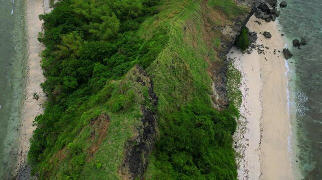 An aerial shot above the mountain range at Capones Island, Pundaquit, San Antonio, Zambales, Philippines