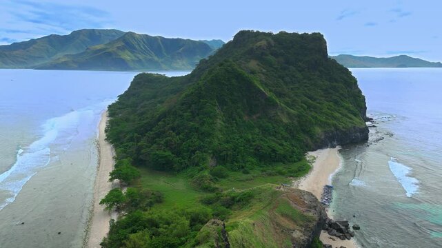Aerial shot very high above mountain range at Capones Island, Pundaquit beach. Zambales, Philippines. Cloudy weather.
