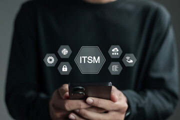 ITSM, Information Technology Service Management concept, IT service management and business. Businessman using smartphone with ITSM icon on virtual screen.