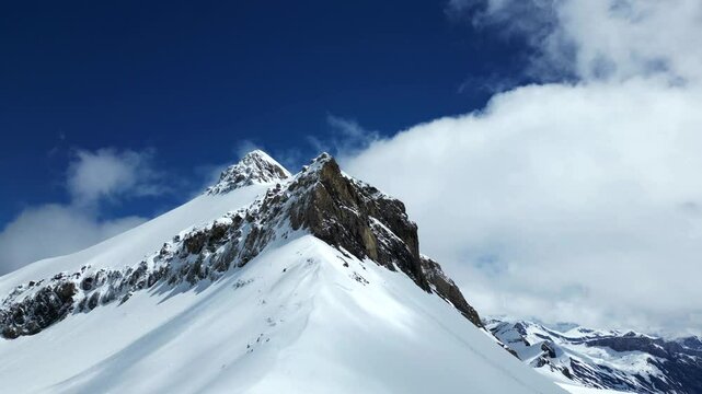 Snow covered peak of Becca d'Audon mountain in Switzerland overlooking the Glacier 3000.