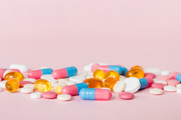 Many different colorful medication and pills perspective view. Set of many pills on colored...