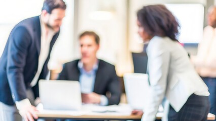 Fototapeta premium A team of professionals negotiating strategies, with a blurred office setting behind them. 