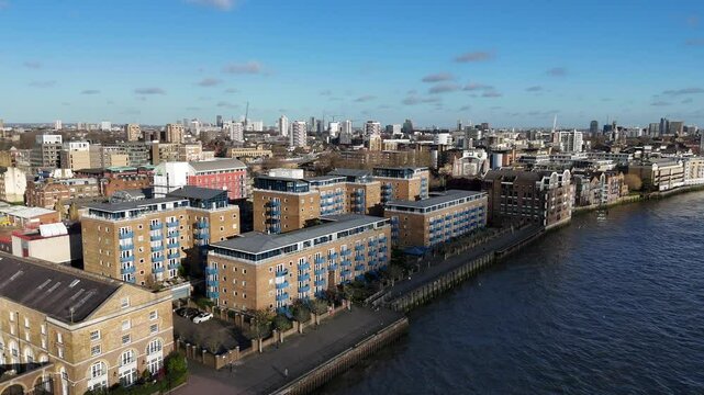 Wapping London UK riverside apartments rising drone,aerial reveal East London