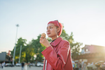 Traveler Gen z girl leather fashion with punk Asian woman tourist of local city Southeast Asia travel enjoying ice cream in summer hot weather
