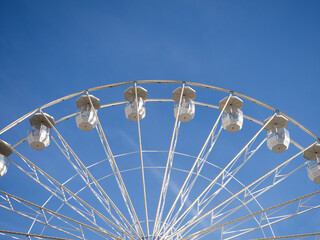 Ferris wheel with blue sky at Bucharest, Romania