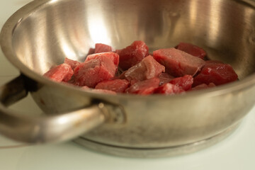 Frying chopped meat in a metal pan