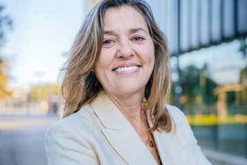 Smiling Mature Woman Outdoors with Confident Expression