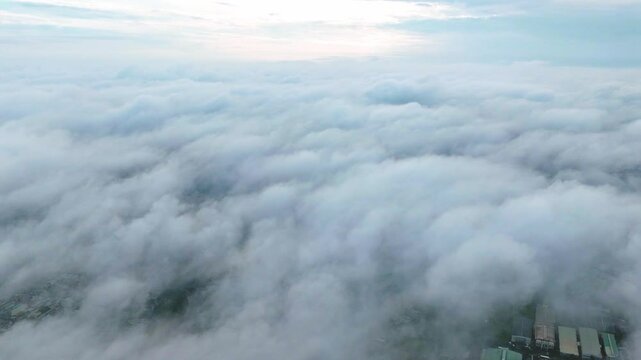 Hyperlapse of Saigon cityscape at morning with misty sky in Southern Vietnam. Urban development texture, transport infrastructure and green parks