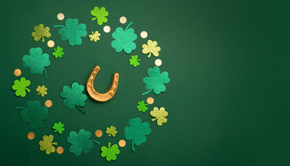 Golden Horseshoe, Gold Coins and Clover Leaves Shamrocks on Green Background for St Patricks Day...