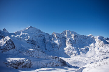 Switzerland Bernina Diavolezza perennial glacier, in winter with snow, Bernina train route. Piz Bernina.
