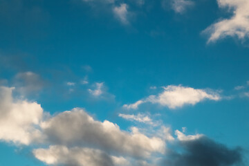 Winter blue sky and cloud. Calm clear winter air background. The sky blue texture clouds. Blue sky and White cloud nature background.