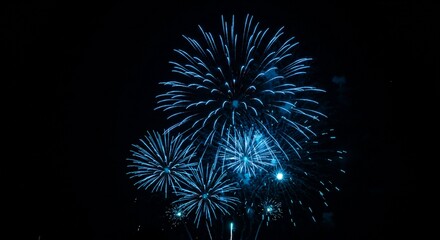 Obraz premium Stunning Blue Fireworks Display at Night Celebration
