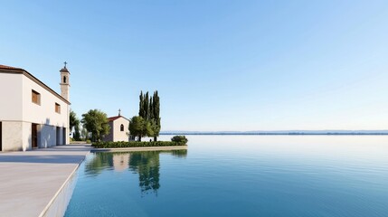 Obraz premium Serene lakeside view with buildings and trees under a clear sky.