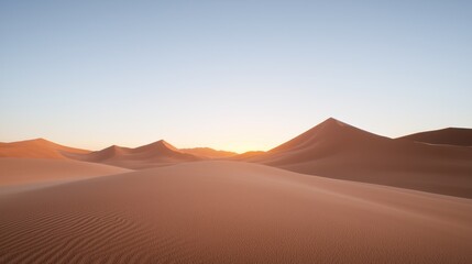 Serene desert landscape at sunset with gentle sand dunes.