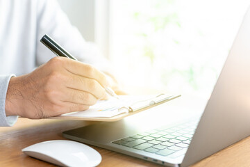 Fototapeta premium Work space at home, financial data graphs, Financial analysis or business evaluation concept