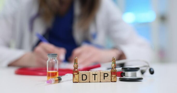 A dedicated healthcare worker prepares the DTP vaccine with a stethoscope and vials for patient safety