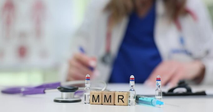 A healthcare professional is actively preparing the MMR vaccine using syringes and various essential medical tools