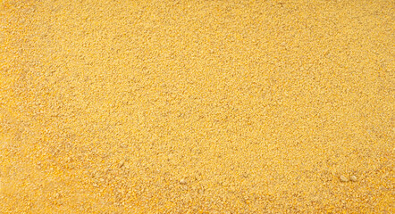 Ground fenugreek seeds texture background, milled dry trigonella powder pattern, methi dana © ange1011