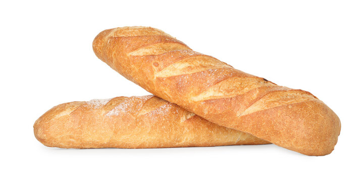 Two freshly baked baguettes isolated on white