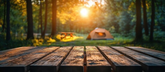 Tranquil Forest Campsite with Sunlit Tent and Wooden Picnic Table in a Serene Natural Setting