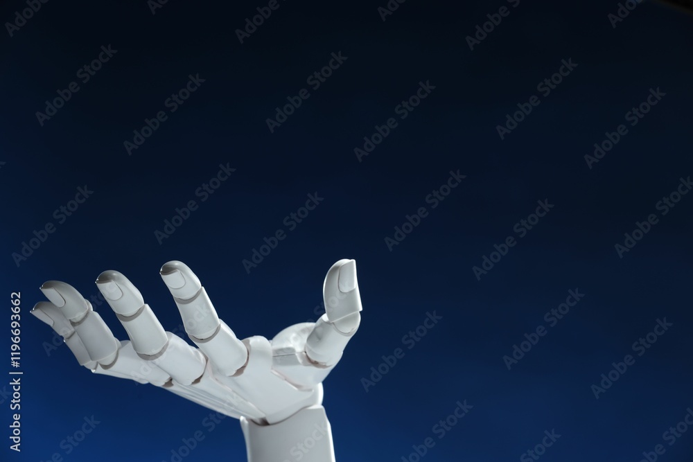 Poster artificial intelligence. robot hand gesturing on dark blue background, space for text