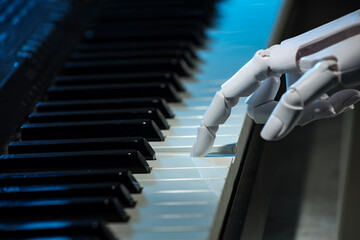 Artificial intelligence. Robot hand playing piano, closeup