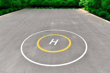 empty helipad surrounded by trees