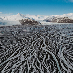 Aerial view of frozen rivers and Heinabergslón glacier lagoon in South Iceland.