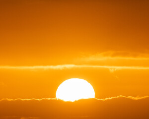 Fototapeta premium Vivid sunset with golden hues illuminating the skies of South Iceland